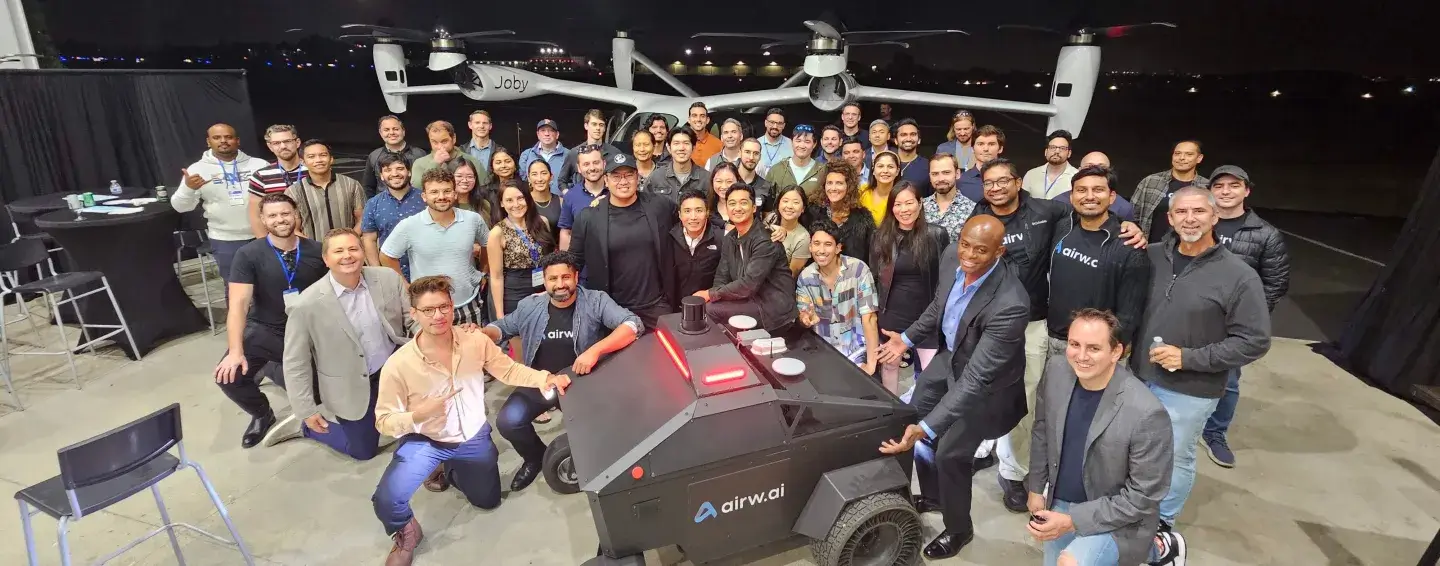 Michael with a group at an aviation and robotics event.